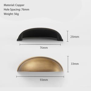 May include: Two semi-circular copper drawer pulls. One is matte black, the other is brushed bronze. Text indicates material: Copper, hole spacing: 76mm, weight: 56g. Dimensions shown: 76mm hole spacing, 28mm height, 93mm total width, and 33mm height.