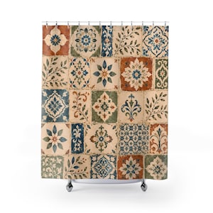 May include: A shower curtain featuring a grid of square tiles with a distressed finish. The pattern displays a variety of floral, geometric, and leaf motifs in shades of terracotta, sage green, navy blue, and cream, suspended by metal rings.