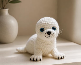 Schema PDF per realizzare un cucciolo di foca all'uncinetto, schema amigurumi realistico per una foca, tutorial per realizzare una foca bianca all'uncinetto, schema PDF per realizzare un peluche di un animale marino