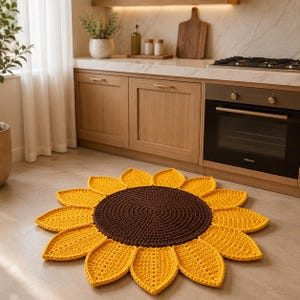 May include: A round, crocheted sunflower rug featuring a dark brown circular center surrounded by numerous bright yellow, petal-shaped segments. The textile floor covering is crafted with a visible yarn texture and is laid flat on a light-colored floor.