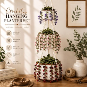 May include: A three-tiered crochet hanging planter set featuring white square baskets with brown rims. Each basket contains a green crocheted succulent with trailing flowers in purple, pink, and red. The set includes text: Crochet Hanging Planter Set.