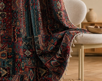 May include: A fabric curtain featuring a dense, multi-coloured geometric pattern in shades of deep red, teal, black, and cream. The textile displays a repeating patchwork design with intricate shapes and includes a decorative white tassel fringe.