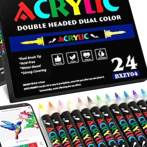 K&ouml;nnte beinhalten: Ein Set aus 24 doppelseitigen Acrylmarkern in einer schwarzen Schachtel mit der Aufschrift ACRYLIC DOUBLE HEADED DUAL COLOR. Die Box listet Merkmale wie Dual-Pinselspitzen, s&auml;urefrei, wasserbasiert und stark deckende Tinte auf.