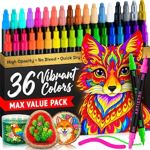 May include: A collection of 36 vibrant colour dot markers in a box, with the text "36 Vibrant Colors MAX VALUE PACK". The box features a colourful fox illustration. Two black markers with green and pink tips are in front.