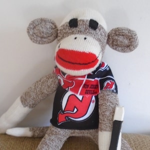 New Jersey Devils Hockey Sock Monkey Doll With Stick And Puck