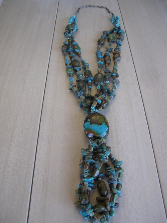 Items similar to Turquoise multistranded necklace with large nugget pendant on Etsy