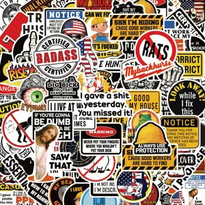 May include: A collection of assorted vinyl stickers featuring various humorous, warning, and novelty designs. The stickers display diverse graphics including skulls, construction themes, text-based slogans, and icons in a wide array of colours.