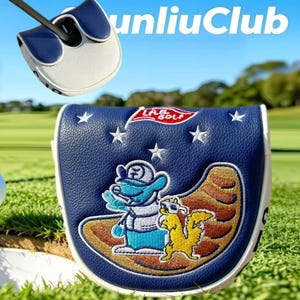 May include: A navy blue and white golf putter headcover featuring an embroidered graphic of a blue character and a yellow squirrel on a brown crescent shape, with white stars and a red L.A.B. GOLF flag logo stitched on the textured synthetic leather.
