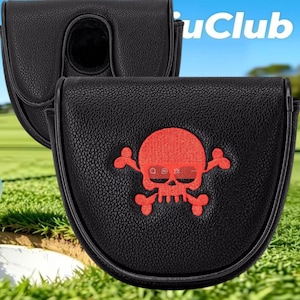 May include: A black textured mallet putter headcover featuring a red embroidered skull and crossbones design on the front. The cover has a rounded shape and a smooth finish. The text "uClub" is partially visible in the upper right corner.