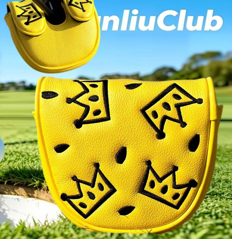 May include: A bright yellow putter headcover featuring a textured surface with embroidered black crown motifs and small black oval accents. The design includes the text "nliuClub" in white lettering. The cover is shaped to fit a mallet-style putter.
