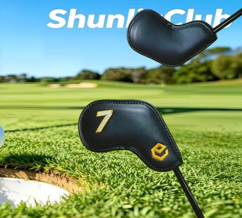 May include: Two black golf club head covers with stitched edges. One cover features a yellow embroidered number 7 and a yellow hexagonal logo. The other cover is plain black. The text ShunliClub is visible in the upper portion of the image.