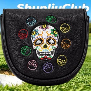May include: A black textured mallet putter headcover featuring a central embroidered sugar skull with colorful floral details and spade-shaped eyes, surrounded by eight smaller embroidered skulls in various colors. The text ShunliuClub is visible.