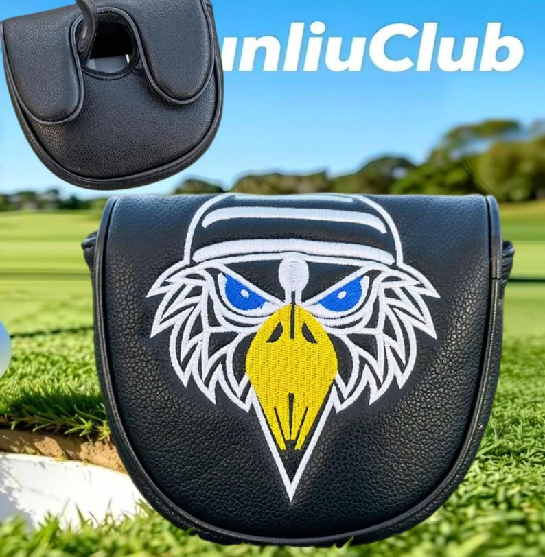 May include: A black leather-like golf putter headcover featuring an embroidered eagle head graphic with blue eyes and a yellow beak. The design includes white outlines and a white cap detail. The text "unliuClub" is visible in the upper right corner.