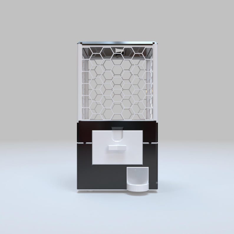May include: A modern gumball machine with a black base and white accents. The top section features a hexagonal grid design, and a white dispensing area is located in the center. A small, white cup sits below.