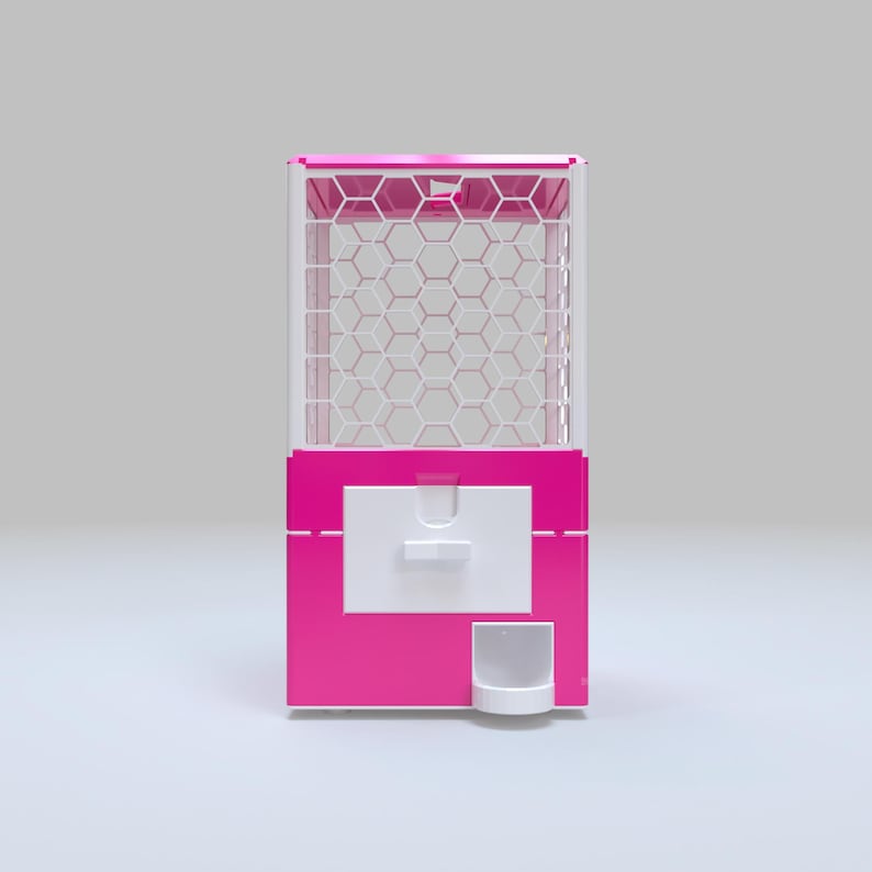 May include: A bright pink gumball machine with a white honeycomb pattern in the viewing area. The machine has a white dispensing door and a small white cup at the bottom. The top of the machine is also pink.