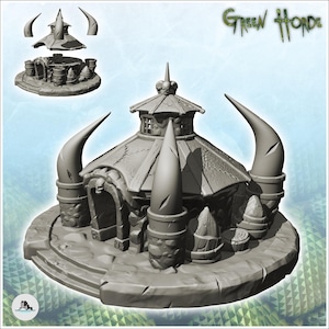 May include: A gray miniature building model labeled Green Horde, featuring a circular stone structure with a peaked roof, a central skull ornament, and large curved spikes. The set includes a detachable roof piece shown separately above the main base.