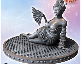 Geisha lounging on a cushion while holding a fan with intricate patterns (2)