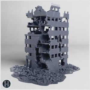 May include: A gray, multi-story building model featuring extensive structural damage, exposed interior floors, and jagged wall sections. The base is surrounded by a pile of scattered debris and rubble, depicting a ruined urban architectural structure.