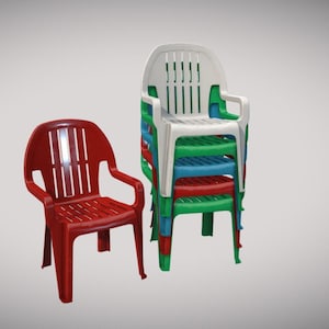 May include: A red plastic chair stands beside a stack of colorful chairs. The stack includes white, green, blue, and red chairs. All chairs have armrests and a slatted back design, suitable for outdoor or indoor use.