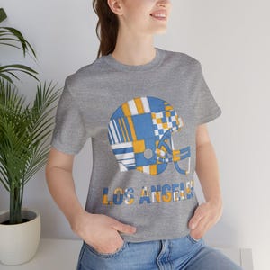 Camiseta de fútbol americano Los Angeles Powder Blue & Gold Patchwork Helmet, camiseta retro para el día del partido, ropa unisex para aficionados, regalo deportivo imagen 1