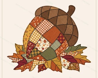 May include: A patchwork acorn illustration featuring a brown cap with a cross-hatched texture and a nut body composed of various fabric patterns in shades of orange, yellow, green, and red, resting on a bed of colorful autumn leaves.