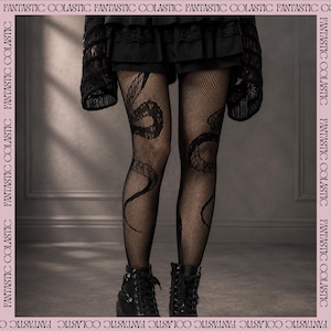 May include: Black fishnet tights featuring a prominent snake pattern winding up each leg. The tights are paired with a black skirt and black lace-up boots. The border of the image contains the repeated text FANTASTIC COLASTIC.