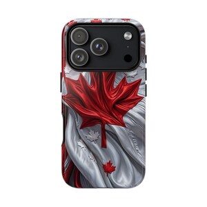 May include: A smartphone case featuring a dynamic, flowing design of the Canadian flag. The surface displays a large, central red maple leaf against a backdrop of white and red fabric-like waves, with smaller maple leaf accents throughout.