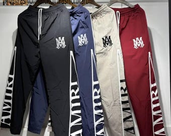 Pantalones deportivos estilo AMIRI, pantalones jogger de estilo urbano para hombre, pantalones cortavientos deportivos, pantalones de moda urbana.