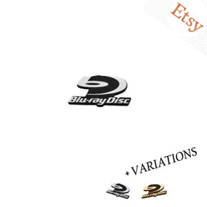 May include: A black and white Blu-ray Disc logo emblem featuring the stylized letter B and the text Blu-ray Disc. Below, two smaller variations are shown: one in black and white and one in a metallic gold color with the text + VARIATIONS.