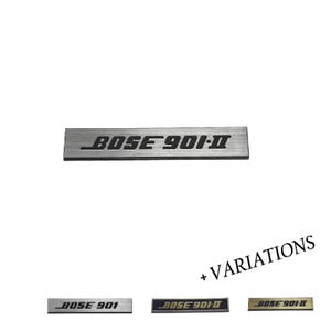 May include: A rectangular silver-toned metal nameplate featuring the black engraved text BOSE 901-II. Below, three additional variations are displayed: a silver plate reading BOSE 901, a dark blue plate reading BOSE 901-II, and a gold plate reading BOSE 901-II.