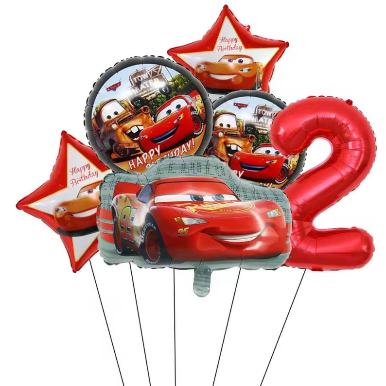 May include: A collection of colorful foil balloons featuring characters from the movie Cars. Includes a red number 2 balloon, star-shaped balloons with Lightning McQueen, and round balloons with Lightning McQueen and Mater. The balloons are for a birthday celebration.