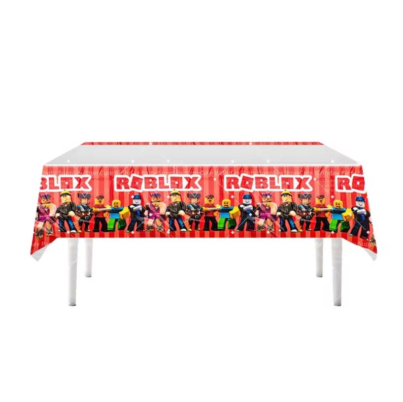 May include: A rectangular plastic tablecloth featuring a red and white striped background with the Roblox logo printed in white text. The design includes a repeating pattern of various blocky character figures across the side panels.