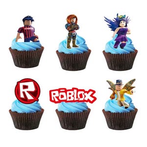 May include: Six chocolate cupcakes in dark brown liners topped with blue frosting and Roblox-themed toppers. The toppers include four distinct character figures, a red circular Roblox logo, and a red Roblox wordmark logo on a white background.