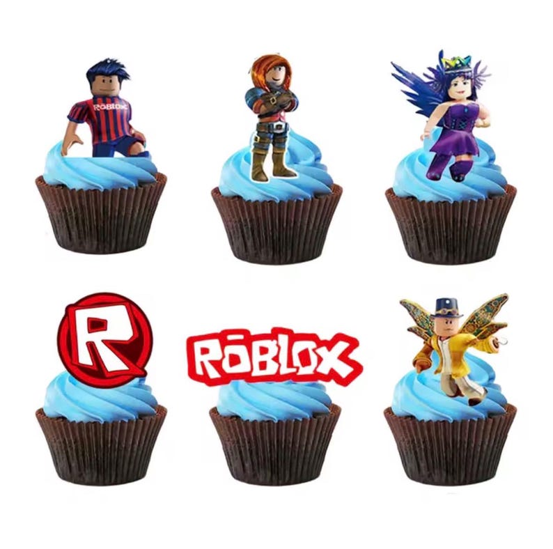 May include: Six chocolate cupcakes in dark brown liners topped with blue frosting and Roblox-themed toppers. The toppers include four distinct character figures, a red circular Roblox logo, and a red Roblox wordmark logo on a white background.