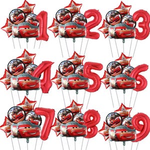 May include: Red foil balloons in the shape of numbers 1 through 9, each accompanied by a cluster of smaller balloons featuring Lightning McQueen and star-shaped balloons. Perfect for a Cars-themed birthday party.
