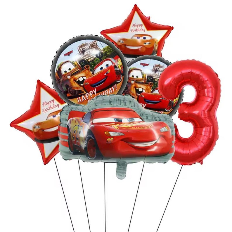 May include: A collection of red and themed balloons. The set includes a large number 3 balloon, star-shaped balloons with the text "Happy Birthday", and round balloons featuring characters from the movie "Cars". The main balloon is shaped like Lightning McQueen.