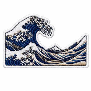 May include: An embroidered patch featuring a stylized ocean wave design in shades of deep blue, white, and beige. The artwork depicts a large cresting wave with foam details and a small mountain peak visible in the background, finished with a white border.