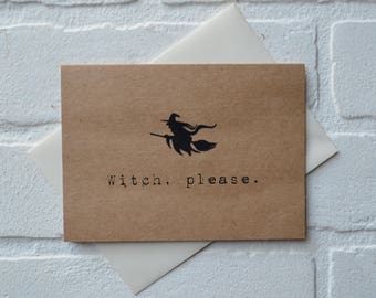 May include: A brown card with a black silhouette of a witch on a broomstick and the text "Witch, please." The card is placed on top of a white envelope. The card and envelope are likely for Halloween or a similar occasion.