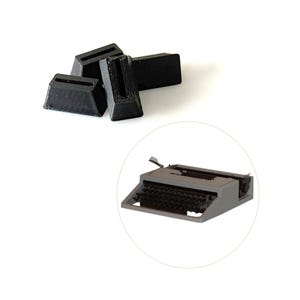 May include: A collection of black typewriter keys and a miniature gray typewriter model are displayed against a white background. The keys are rectangular with a grooved top. The typewriter model is detailed.