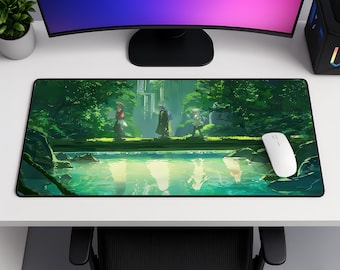 May include: A rectangular desk mat featuring a vibrant green forest scene with three figures standing on a log bridge over a reflective stream. The artwork displays lush trees, foliage, and soft light, with a white computer mouse resting on the right side.