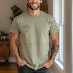 May include: Olive green t-shirt featuring a black mushroom graphic. The shirt has a crew neck and short sleeves. The text "DIGITAL DOWNLOAD ONLY" is visible on the shirt. The shirt is made of a soft, comfortable material.