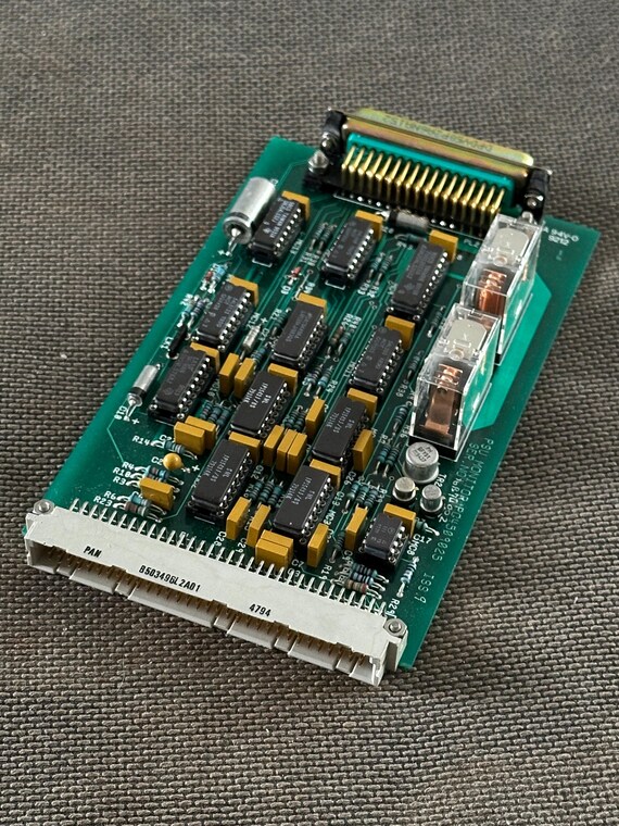 A decommissioned NATO-era power supply board turned into wearable/displayable industrial jewelry — the kind of object that sparks a 10-minute conversation.