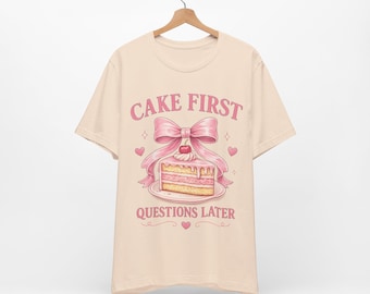 Cake First Questions Later Shirt, Coquette Cake Tee, Pink Bow Dessert Shirt, Cute Bakery Shirt, Girly Cake Lover Graphic Tee