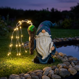 May include: A whimsical garden gnome statue of a wizard, wearing a blue hat with purple stars and a long white beard. The gnome holds a staff with a green orb and a book. A string of small lights emanates from the staff, illuminating the statue.