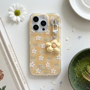 Funda para iPhone con estampado de margaritas y cuadros vichy, funda de TPU suave y transparente con un lindo dije de flor, funda kawaii para ella, lindo regalo de cumpleaños