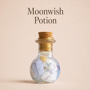 May include: A small, clear glass bottle with a cork stopper, labeled Moonwish Potion. The bottle is filled with an assortment of smooth, tumbled stones in shades of pale blue, white, and yellow, creating a decorative display of natural minerals.