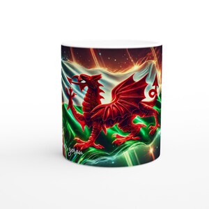 May include: White ceramic mug featuring a vibrant red Welsh dragon design set against a backdrop of the Welsh flag. The design includes green, white, and red colors, with the text "gorau" in a script font.