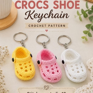 May include: Three miniature crochet shoe keychains in yellow, pink, and white, each featuring a metal ring and black side buttons. The text reads CROCHET CROCS SHOE Keychain CROCHET PATTERN and Stitchaurastudio 10 with small heart icons.