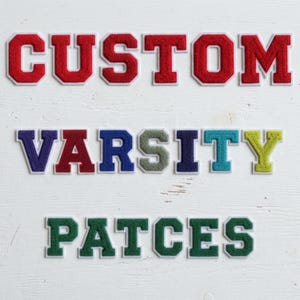 May include: A collection of varsity-style letter patches arranged in three rows. The top row spells CUSTOM in red, the middle row spells VARSITY in various colors, and the bottom row spells PATCES in green. Each letter features a white border.