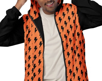 May include: A hooded jacket with a vibrant orange front, patterned with black lightning bolts. The sleeves and hood are black. The jacket is fully zipped and worn by a person.